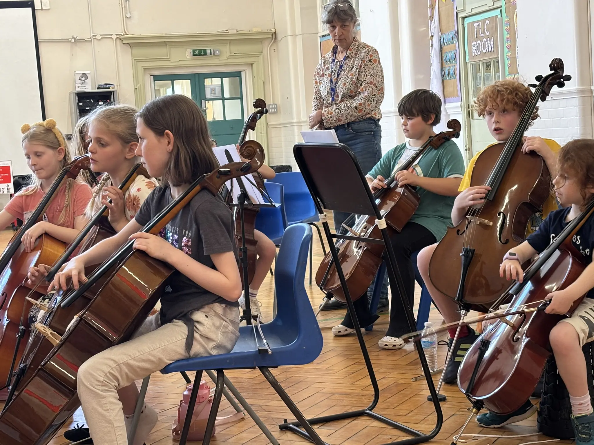Young string players taking part in a school-based Fun Day